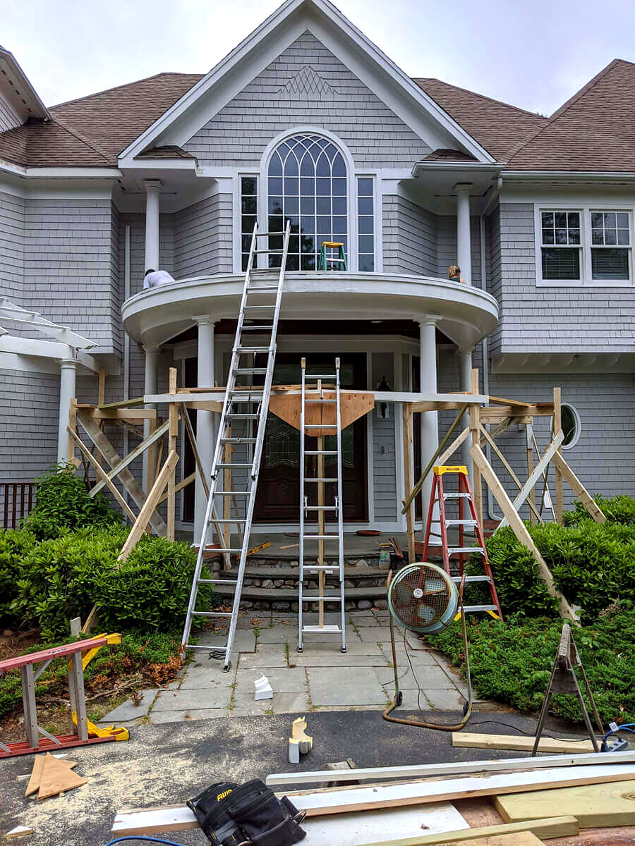 Front entry portico with custom columns being built — Connecticut carpentry project